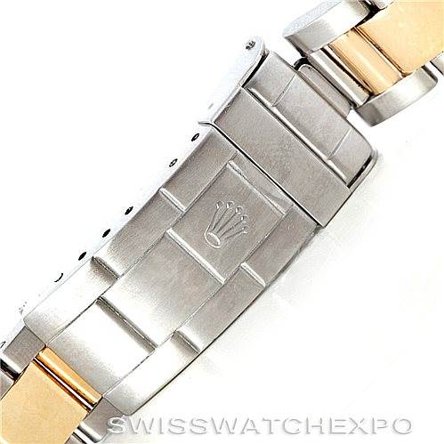 This image shows the clasp and part of the bracelet of a Rolex Submariner 16613 Men's Steel and Gold (two tone) Blue Dial 16613 Men's Steel and Gold (two tone) Blue Dial watch, featuring a combination of stainless steel and gold links.