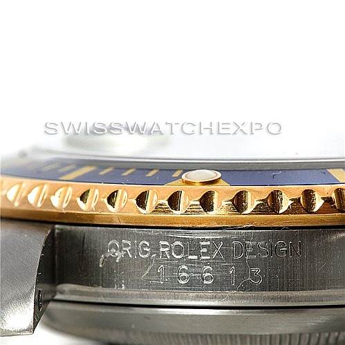 The image shows a close-up, side view of a Rolex Submariner 16613 Men's Steel and Gold (two tone) Blue Dial 16613 Men's Steel and Gold (two tone) Blue Dial watch, highlighting the bezel, case, and model engravings (16613).