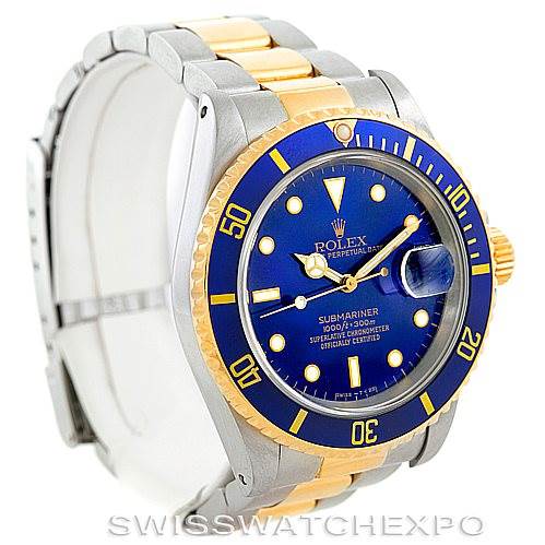 The Rolex Submariner 16613 Men's Steel and Gold (two tone) Blue Dial 16613 Men's Steel and Gold (two tone) Blue Dial watch is displayed at an angle showing the dial, bezel, case, and part of the bracelet.