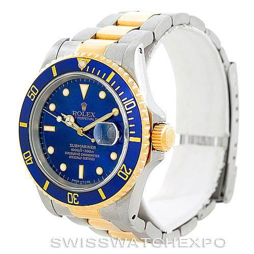 This image shows a Rolex Submariner 16613 Men's Steel and Gold (two tone) Blue Dial 16613 Men's Steel and Gold (two tone) Blue Dial watch at a three-quarter angle, highlighting its blue dial, bezel, and two-tone bracelet.