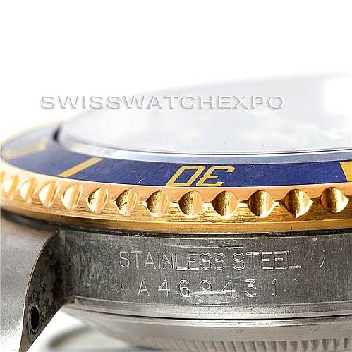 This close-up angle shows the edge of the bezel and part of the engraving on the case of a Rolex Submariner 16613 Men's Steel and Gold (two tone) Blue Dial 16613 Men's Steel and Gold (two tone) Blue Dial.