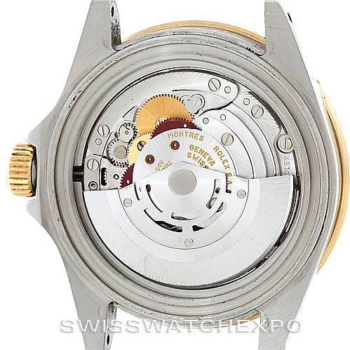 The image shows the internal movement and mechanics of a Rolex Submariner 16613 Men's Steel and Gold (two tone) Blue Dial 16613 Men's Steel and Gold (two tone) Blue Dial watch from a rear angle with the case back removed.