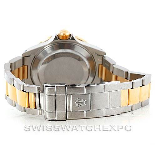 The image shows the back of a Rolex Submariner 16613 Men's Steel and Gold (two tone) Blue Dial 16613 Men's Steel and Gold (two tone) Blue Dial watch, highlighting the case back, bracelet, and clasp.