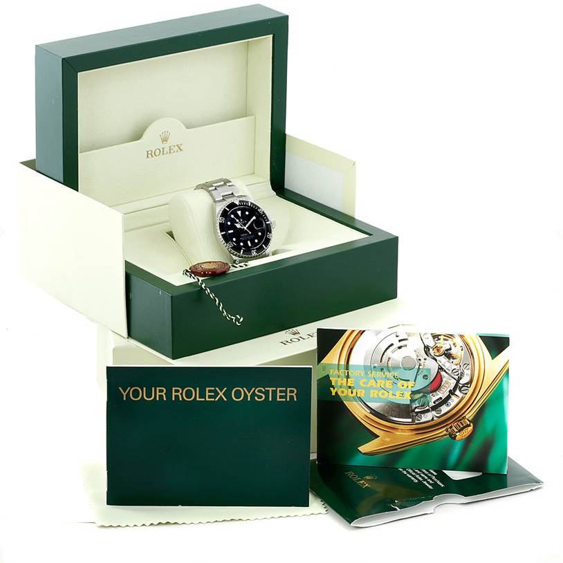 The image shows a Rolex Submariner 16610 Men's Stainless Steel Black Dial 16610 Men's Stainless Steel Black Dial watch in its presentation box, along with manuals and a warranty card.