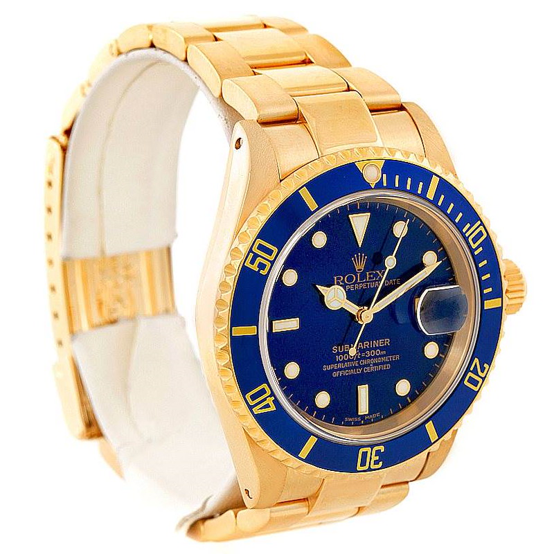 The image shows a Rolex Submariner 16618 Men's Yellow Gold Blue Dial 16618 Men's Yellow Gold Blue Dial watch at a slight angle, highlighting the dial, bezel, case, and bracelet.