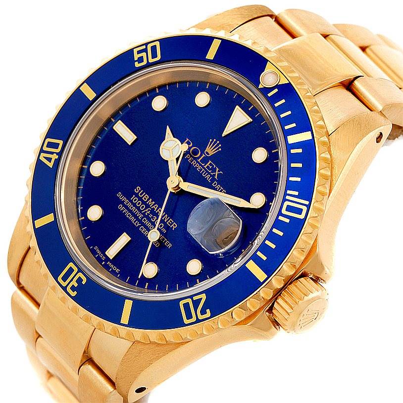 The image shows a Rolex Submariner 16618 Men's Yellow Gold Blue Dial 16618 Men's Yellow Gold Blue Dial watch angled to display the dial, bezel, crown, and part of the bracelet.