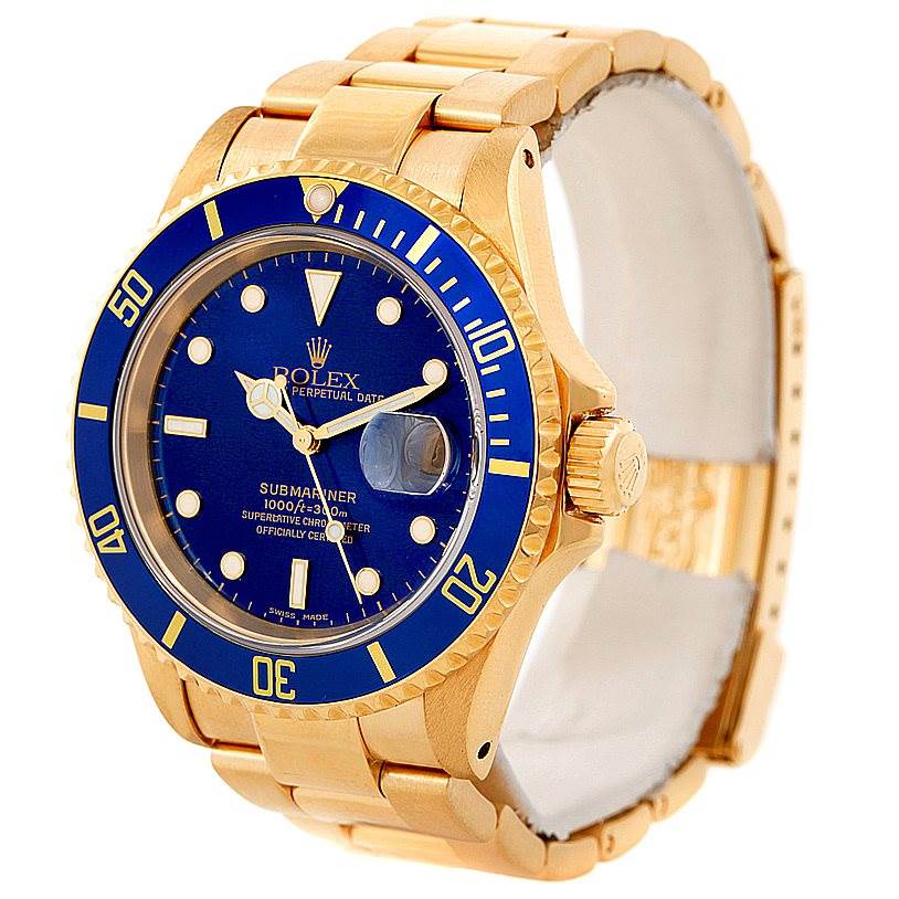 This image shows a Rolex Submariner 16618 Men's Yellow Gold Blue Dial 16618 Men's Yellow Gold Blue Dial watch from a slight right side angle, highlighting its blue dial, bezel, and gold bracelet.
