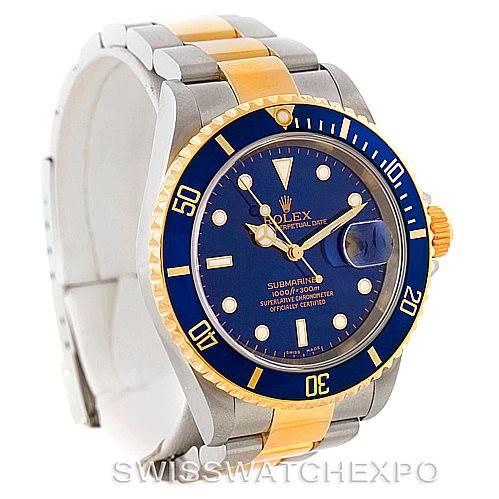 This image shows a Rolex Submariner 16613 Men's Steel and Gold (two tone) Blue Dial 16613 Men's Steel and Gold (two tone) Blue Dial watch from an angled front view, highlighting the blue dial, bezel, and two-tone bracelet.