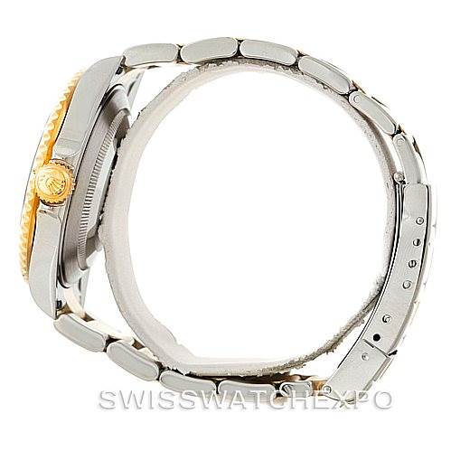 The image shows a side view of a Rolex Submariner 16613 Men's Steel and Gold (two tone) Blue Dial 16613 Men's Steel and Gold (two tone) Blue Dial watch, highlighting its crown, case, and part of the bracelet.