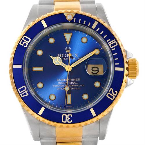 The image shows a front angle of a Rolex Submariner 16613 Men's Steel and Gold (two tone) Blue Dial 16613 Men's Steel and Gold (two tone) Blue Dial watch, highlighting its blue dial, gold accents, and date function.