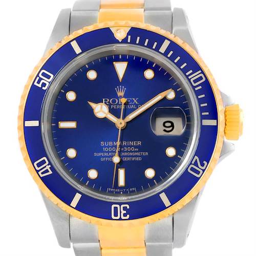 The image shows a front view of a Rolex Submariner 16613 Men's Steel and Gold (two tone) Blue Dial 16613 Men's Steel and Gold (two tone) Blue Dial watch, highlighting its blue dial, date display, and two-tone bezel.