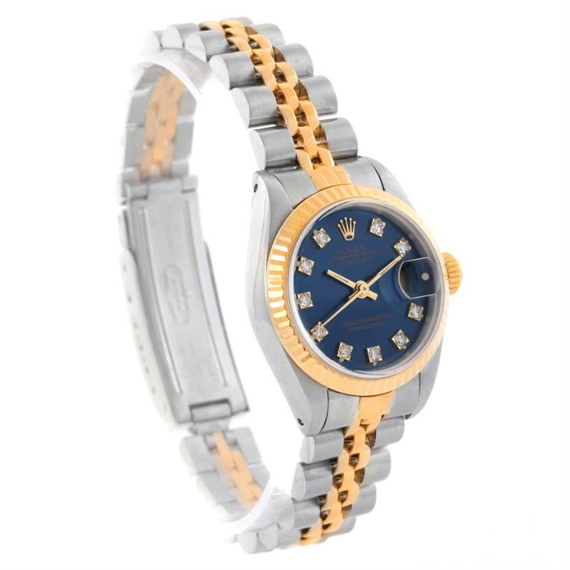 This is a side angle view of a Rolex Datejust 69173 Women's Stainless Steel Blue Dial 69173 Women's Stainless Steel Blue Dial watch, showcasing the face, bezel, crown, and two-tone bracelet.