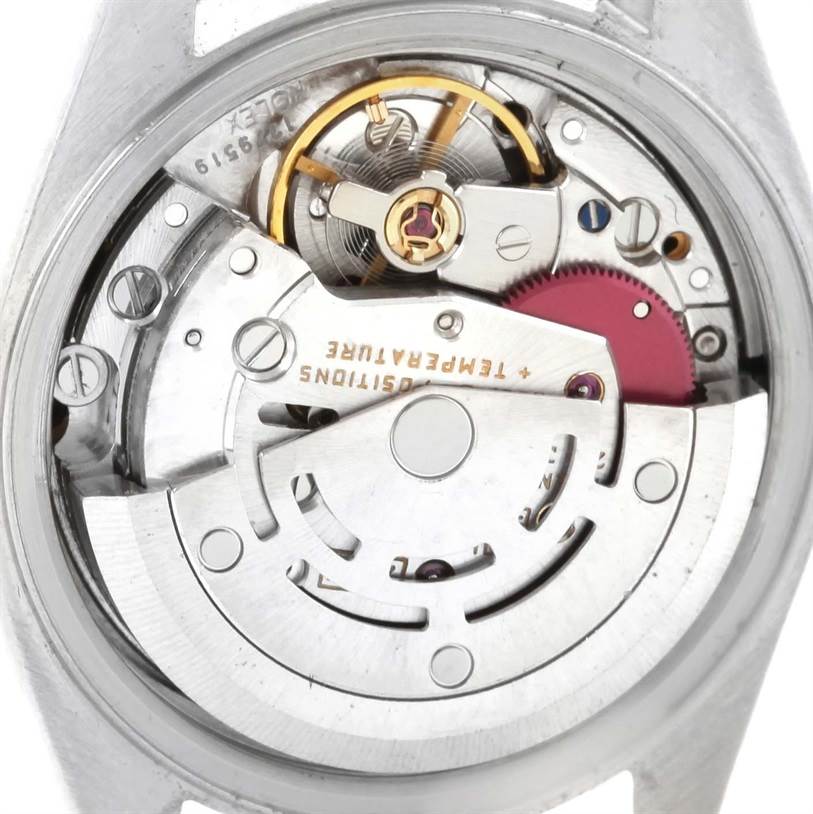 This image shows the intricate movement and internal components of a Rolex Datejust 69173 Women's Stainless Steel Blue Dial 69173 Women's Stainless Steel Blue Dial watch from a close-up angle.