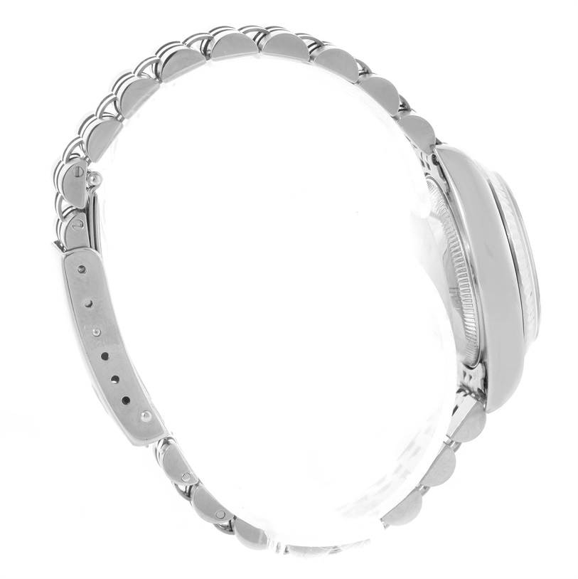 This side-view image of a Rolex Datejust 79174 Women's Stainless Steel Mother of Pearl Dial 79174 Women's Stainless Steel Mother of Pearl Dial watch shows the bracelet and the side profile of the case.