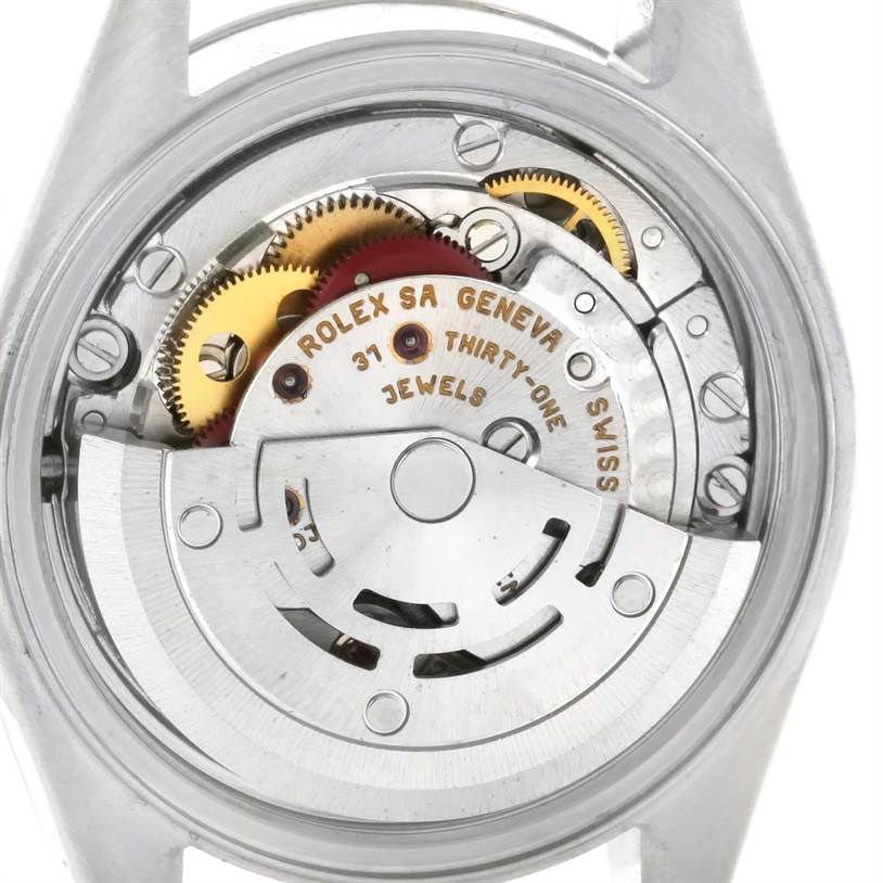 This is an internal view of the Rolex Datejust 79174 Women's Stainless Steel Mother of Pearl Dial 79174 Women's Stainless Steel Mother of Pearl Dial watch, showing the movement and gears.