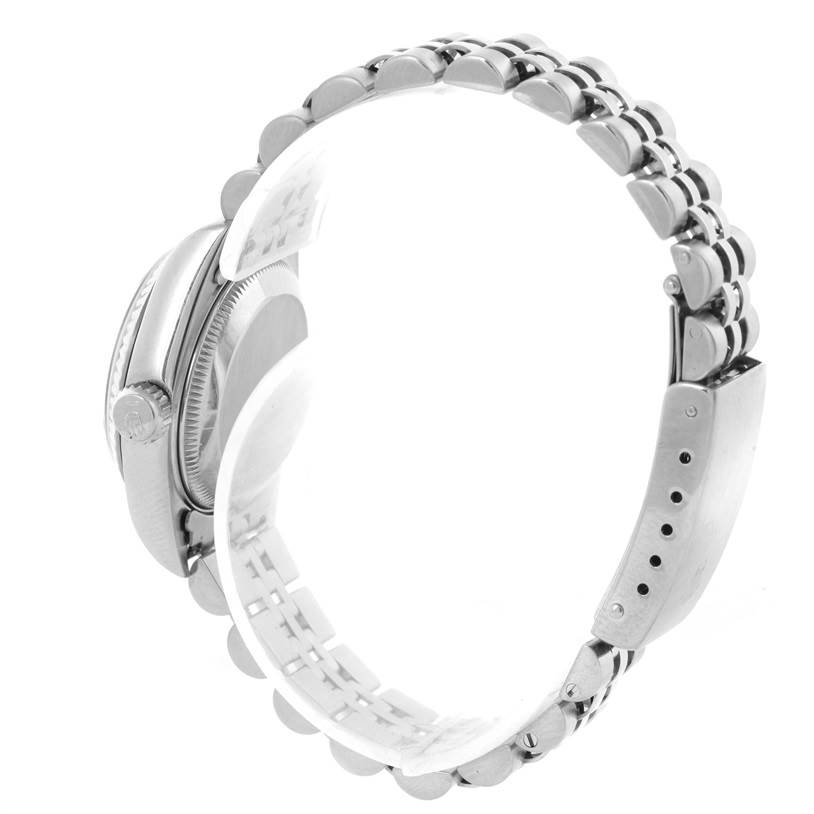 This side view of the Rolex Datejust 69174 Women's Stainless Steel Black Dial 69174 Women's Stainless Steel Black Dial watch shows its clasp, links, and partially the crown.