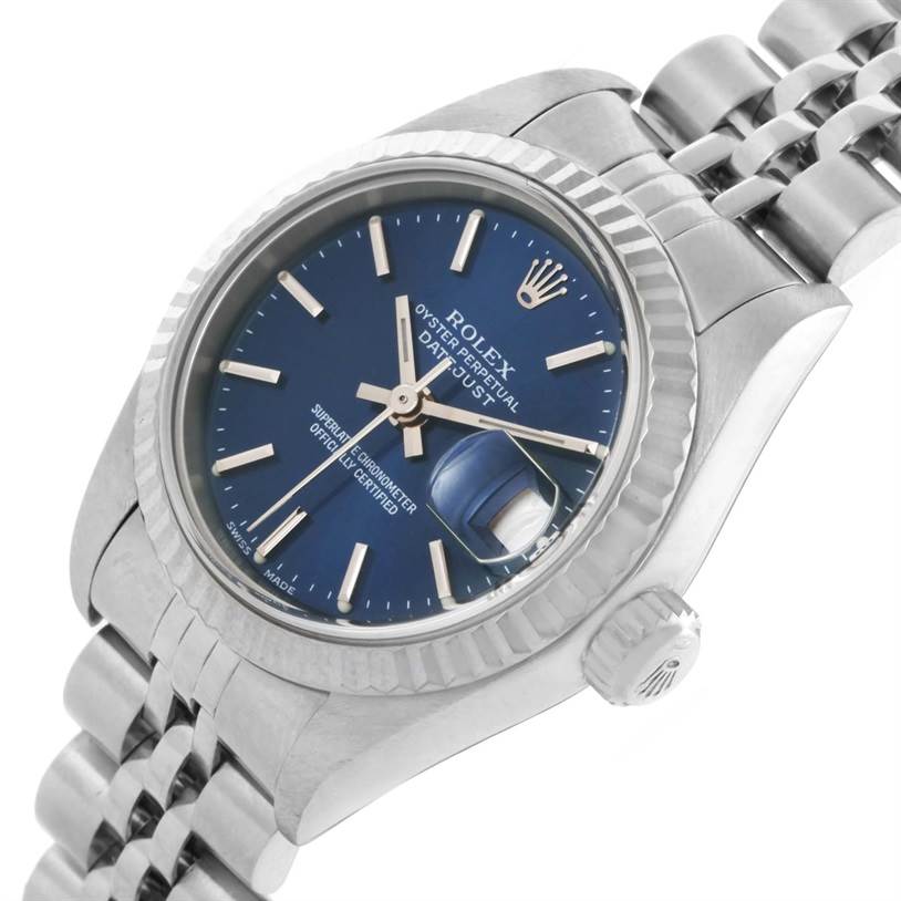 This image shows a Rolex Datejust 79174 Women's Stainless Steel Blue Dial 79174 Women's Stainless Steel Blue Dial watch at an angle highlighting the dial, fluted bezel, crown, and part of the bracelet.