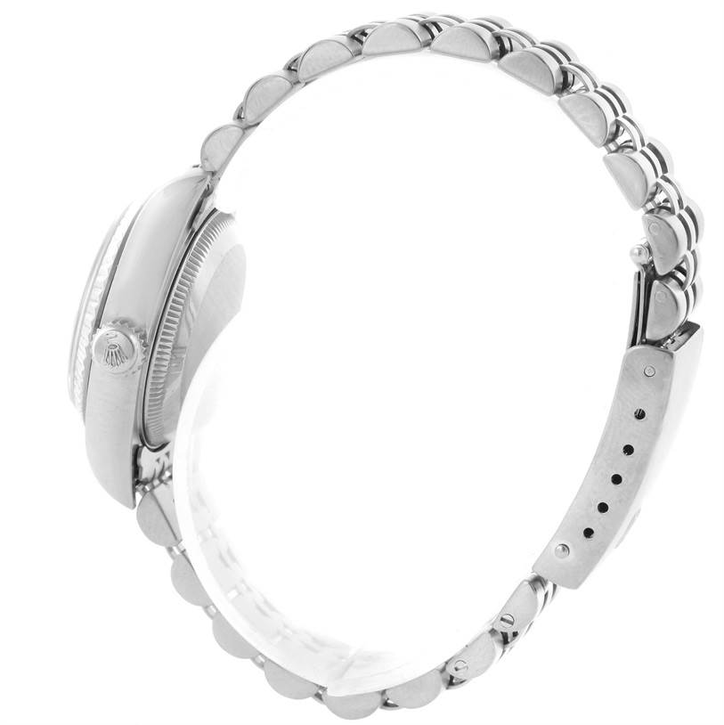 This side view of the Rolex Datejust 79174 Women's Stainless Steel Blue Dial 79174 Women's Stainless Steel Blue Dial watch showcases its crown, case profile, and bracelet.