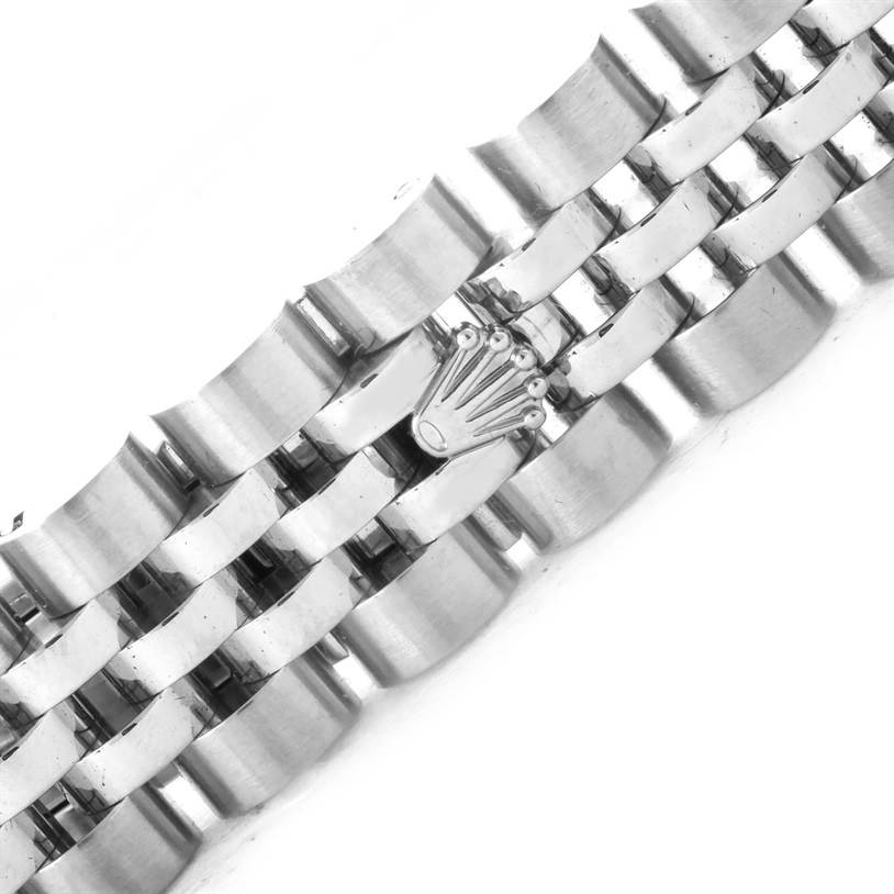 The image shows a close-up of the bracelet of a Rolex Datejust 179174 Women's Stainless Steel Mother of Pearl Dial 179174 Women's Stainless Steel Mother of Pearl Dial watch, highlighting the clasp with the Rolex crown logo.