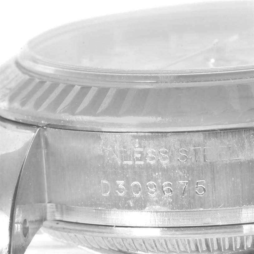 This close-up image shows the side profile and engraving on a Rolex Datejust 179174 Women's Stainless Steel Mother of Pearl Dial 179174 Women's Stainless Steel Mother of Pearl Dial watch case.