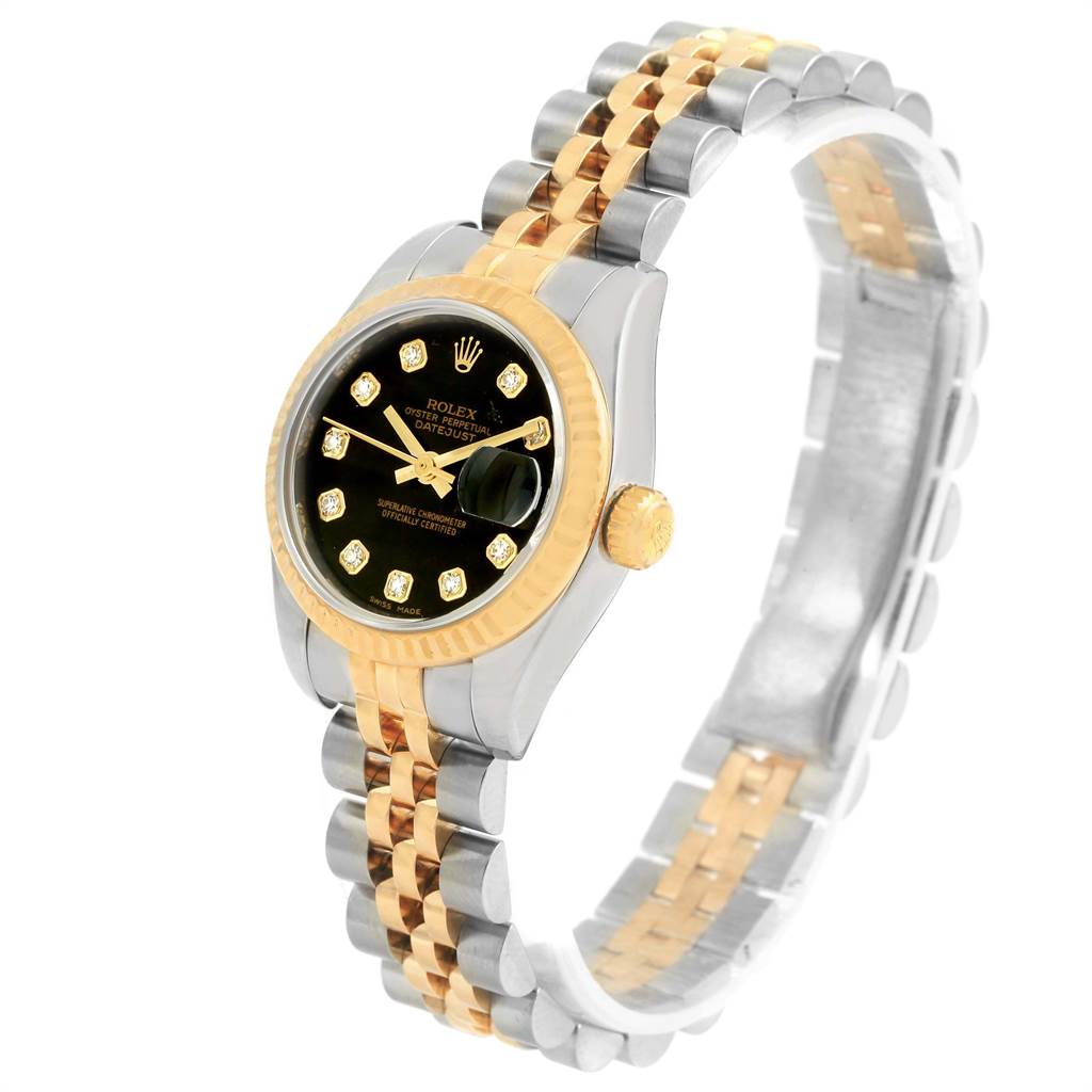 The image shows a Rolex Datejust 179173 Women's Steel and Gold (two tone) Black Dial 179173 Women's Steel and Gold (two tone) Black Dial watch at a three-quarter angle, highlighting its face, bezel, crown, and two-tone bracelet.