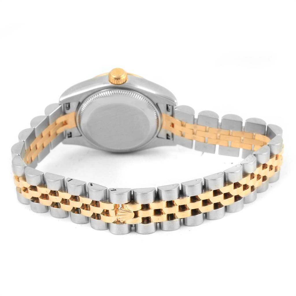 The Rolex Datejust 179173 Women's Steel and Gold (two tone) Black Dial 179173 Women's Steel and Gold (two tone) Black Dial watch is shown from the back, displaying its case back and the two-tone jubilee bracelet.