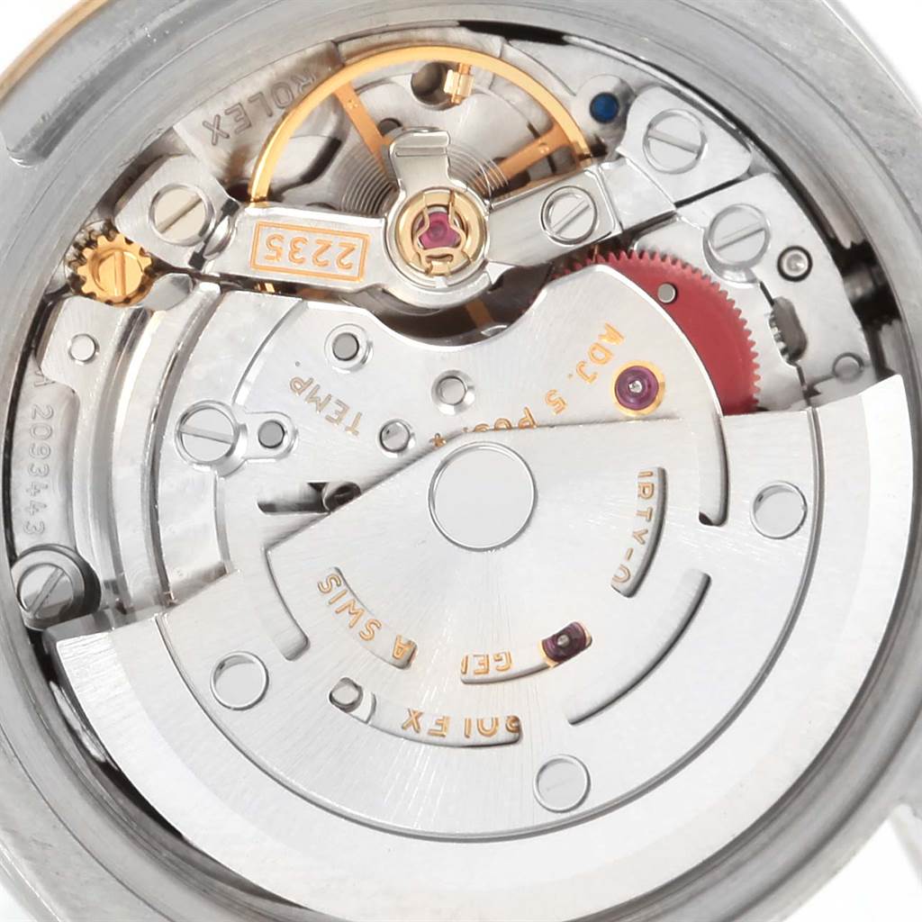 This image shows a close-up view of the internal mechanism of a Rolex Datejust 179173 Women's Steel and Gold (two tone) Black Dial 179173 Women's Steel and Gold (two tone) Black Dial watch, displaying its intricate components.