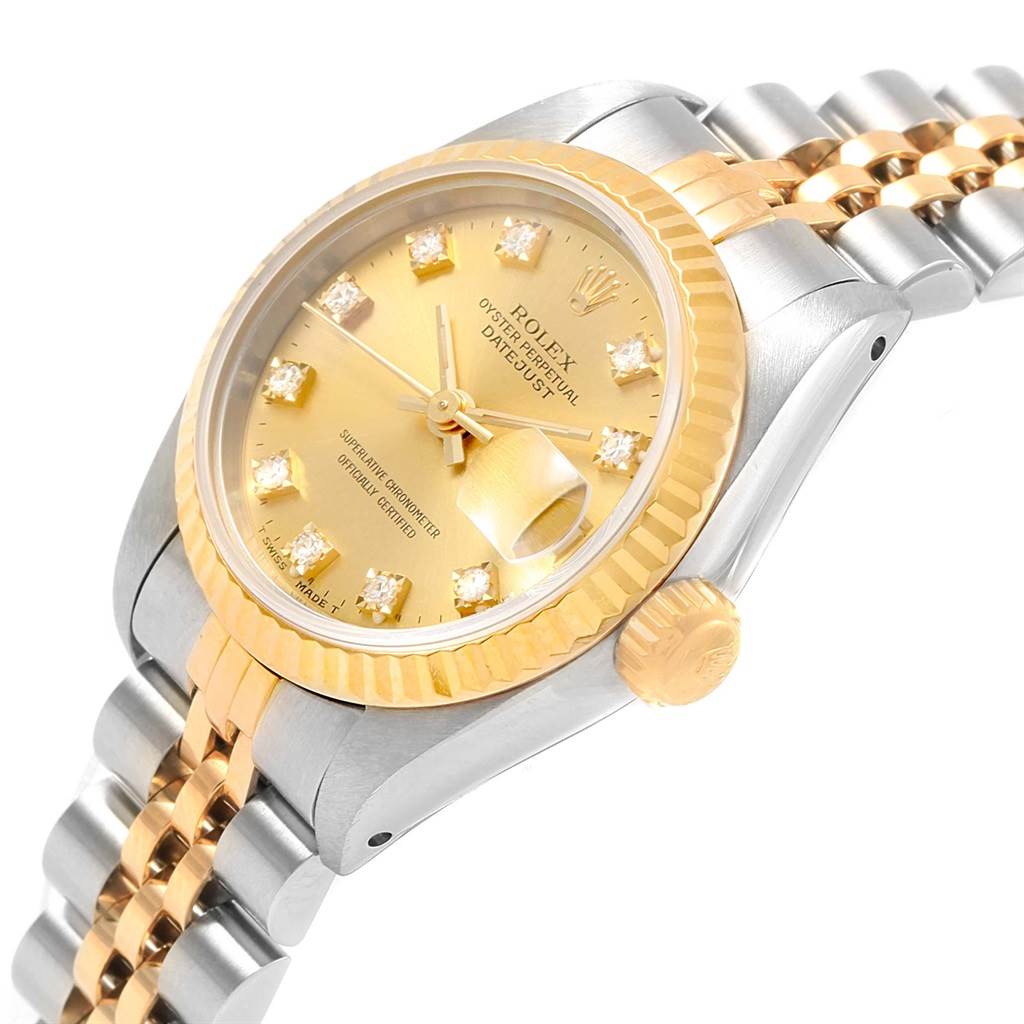 The image shows a Rolex Datejust 69173 Women's Stainless Steel Champagne Dial 69173 Women's Stainless Steel Champagne Dial model watch at a slight angle, highlighting its gold dial, fluted bezel, and two-tone bracelet.