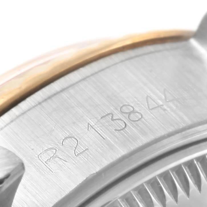 This close-up image shows the serial number engraved on the case of a Rolex Datejust 69173 Women's Stainless Steel White Dial 69173 Women's Stainless Steel White Dial watch.