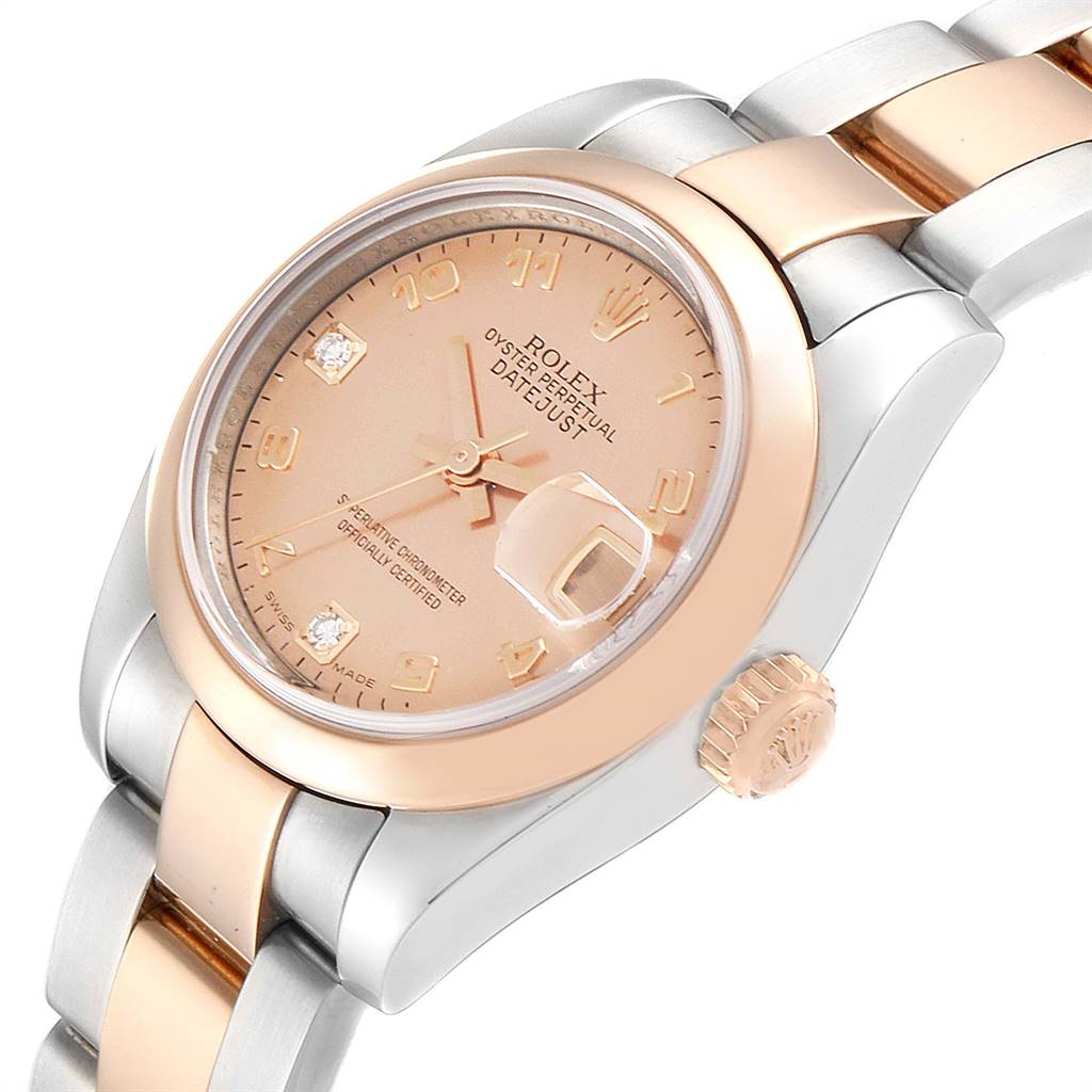 The Rolex Datejust 179161 Women's Steel and Gold (two tone) Pink Dial 179161 Women's Steel and Gold (two tone) Pink Dial watch is shown from a slight side angle, highlighting its dial, bezel, crown, and part of the bracelet.