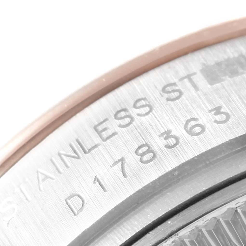 This image shows a close-up of the back casing with engravings on a Rolex Datejust 179161 Women's Steel and Gold (two tone) Pink Dial 179161 Women's Steel and Gold (two tone) Pink Dial watch.