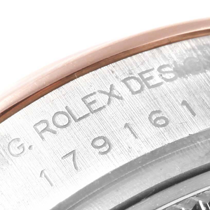 This image shows a close-up of the engraved serial number and branding on the side of a Rolex Datejust 179161 Women's Steel and Gold (two tone) Pink Dial 179161 Women's Steel and Gold (two tone) Pink Dial watch case.