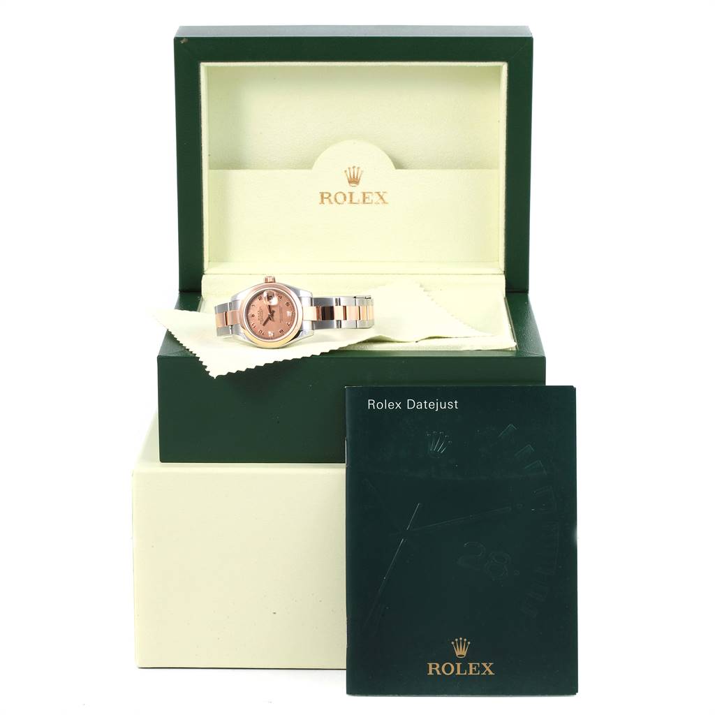 The image shows a Rolex Datejust 179161 Women's Steel and Gold (two tone) Pink Dial 179161 Women's Steel and Gold (two tone) Pink Dial watch at a slight angle, inside its open box with a polishing cloth and the instruction booklet.