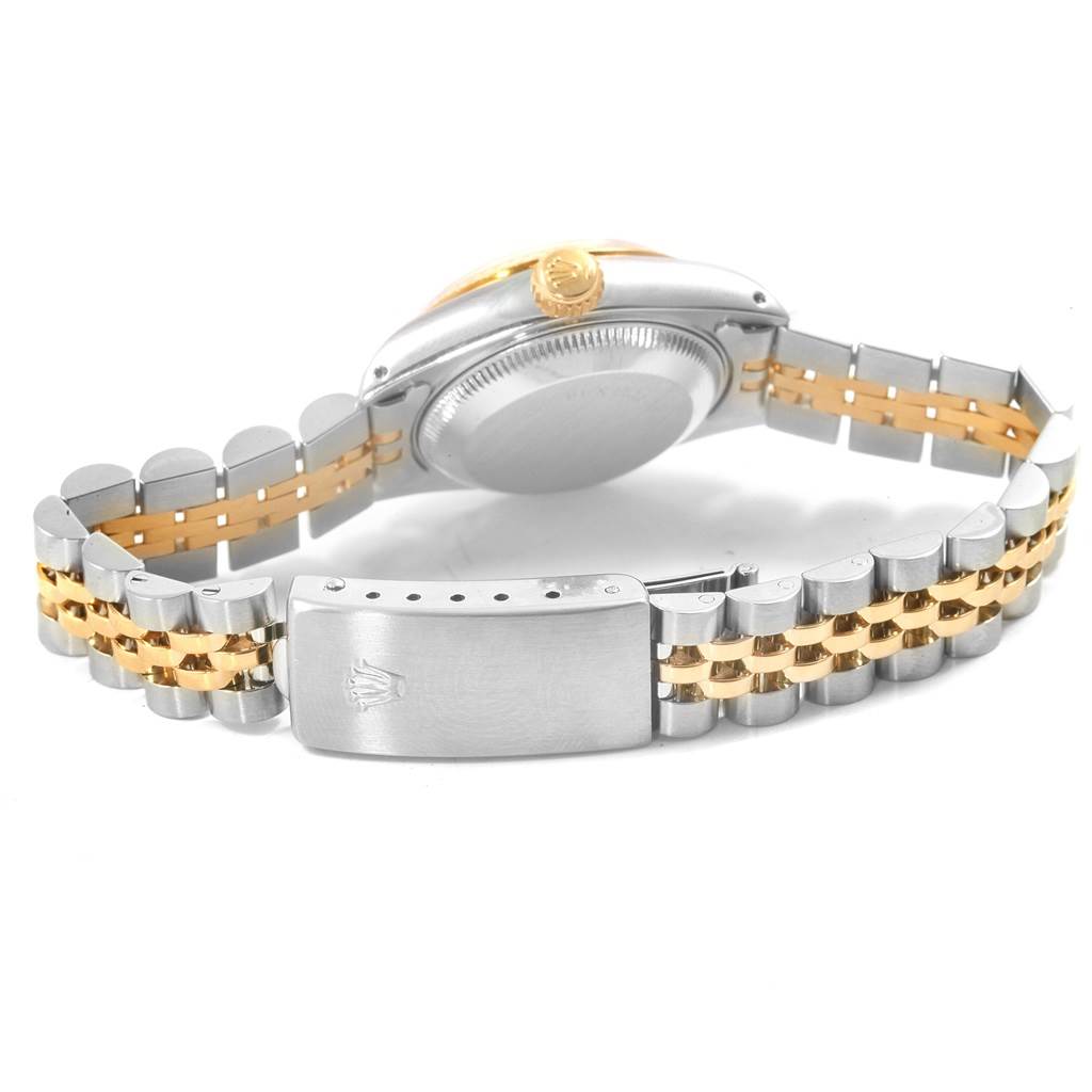 This Rolex Datejust 69173 Women's Stainless Steel Beige Dial 69173 Women's Stainless Steel Beige Dial watch is shown from the back, highlighting the case back, crown, and two-tone bracelet.