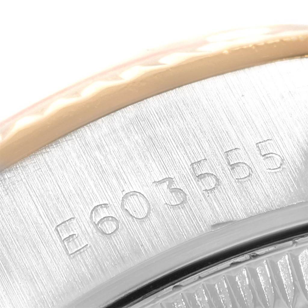 This image shows a close-up of the serial number on the case back edge of a Rolex Datejust 69173 Women's Stainless Steel Beige Dial 69173 Women's Stainless Steel Beige Dial watch.