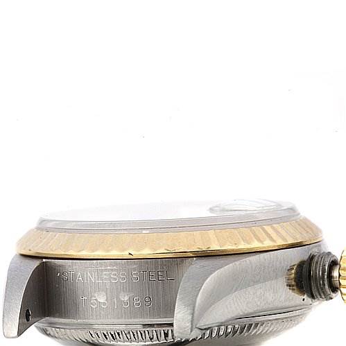 This image shows a side view of a Rolex Datejust 69173 Women's Stainless Steel Silver Dial 69173 Women's Stainless Steel Silver Dial watch, focusing on the case, crown, and part of the bezel.