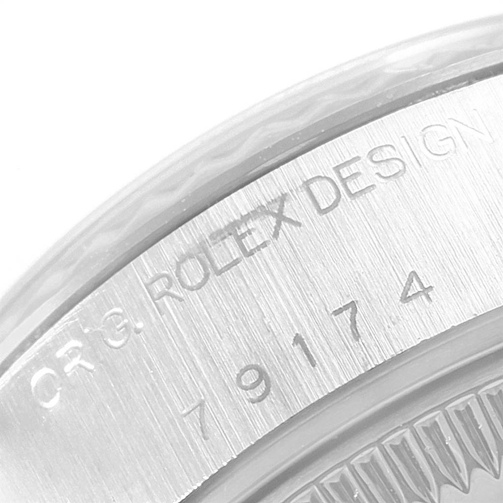 This is a close-up image of the engraved case back of a Rolex Datejust 79174 Women's Stainless Steel Silver Dial 79174 Women's Stainless Steel Silver Dial watch.