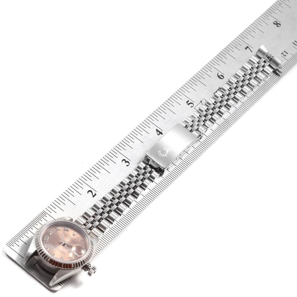 The image shows a Rolex Datejust 79174 Women's Stainless Steel Pink Dial 79174 Women's Stainless Steel Pink Dial watch laid flat next to a ruler, displaying the watch face and the bracelet.