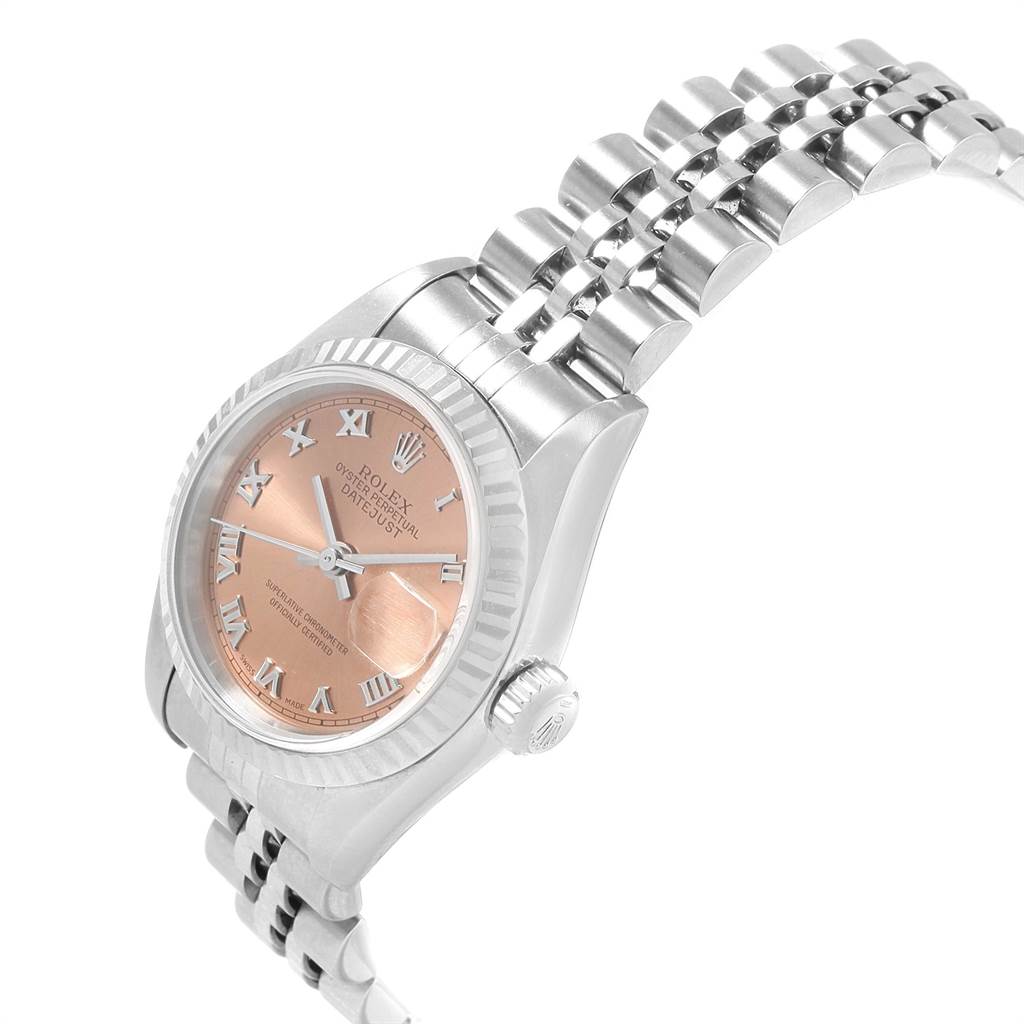 The image shows a Rolex Datejust 79174 Women's Stainless Steel Pink Dial 79174 Women's Stainless Steel Pink Dial watch with a pink dial, viewed at an oblique angle, highlighting the dial, crown, and bracelet.