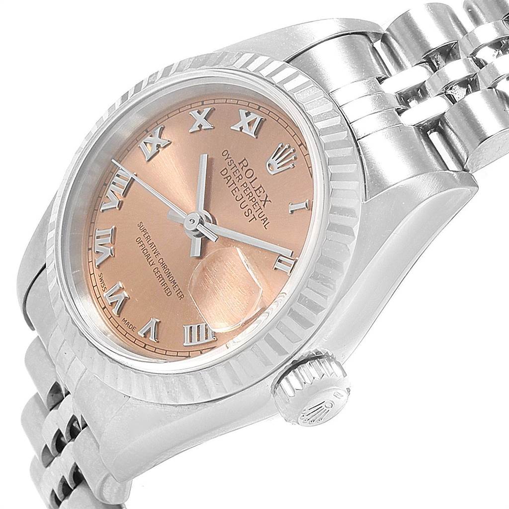 The image shows a side and slightly tilted view of a Rolex Datejust 79174 Women's Stainless Steel Pink Dial 79174 Women's Stainless Steel Pink Dial, highlighting the watch face, crown, and part of the bracelet.
