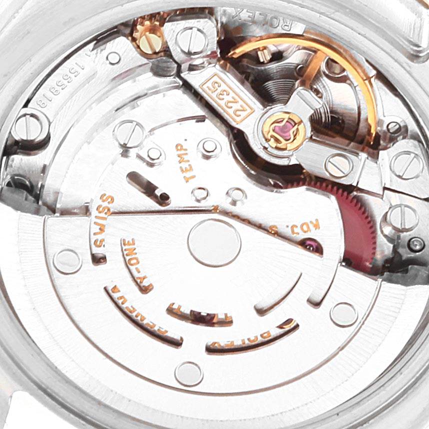 The image shows a close-up of the Rolex Datejust 179163 Women's Steel and Gold (two tone) Champagne Dial 179163 Women's Steel and Gold (two tone) Champagne Dial watch movement including the rotor and intricate components.