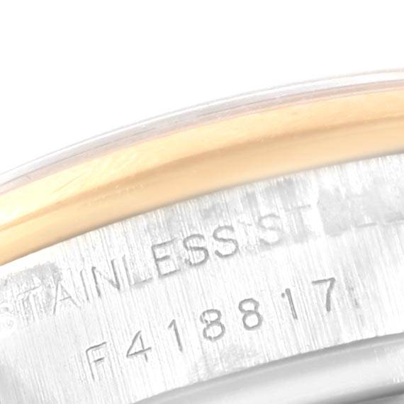 This image shows a close-up of the outer rim and serial number of a Rolex Datejust 179163 Women's Steel and Gold (two tone) Champagne Dial 179163 Women's Steel and Gold (two tone) Champagne Dial watch.