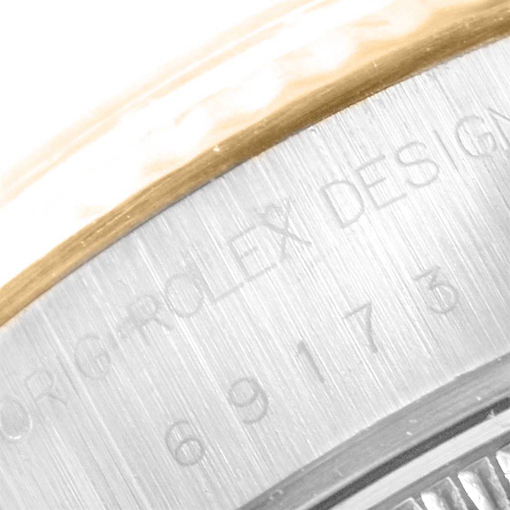 The image shows a close-up of the case back of a Rolex Datejust 69173 Women's Stainless Steel White Dial 69173 Women's Stainless Steel White Dial, displaying the model number and partial Rolex engraving.