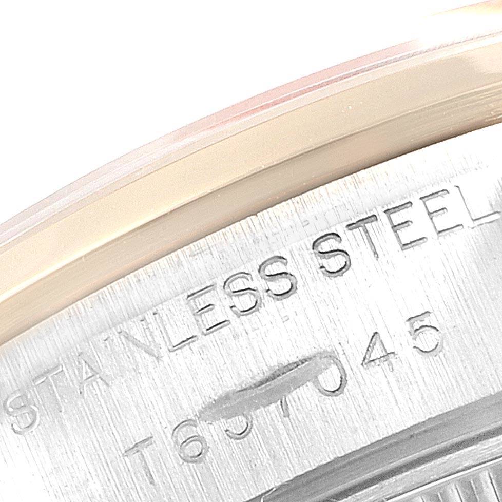 The image shows a close-up of the edge and caseback of a Rolex Datejust 69163 Women's Steel and Gold (two tone) Grey Dial 69163 Women's Steel and Gold (two tone) Grey Dial, highlighting the stainless steel material engraving.