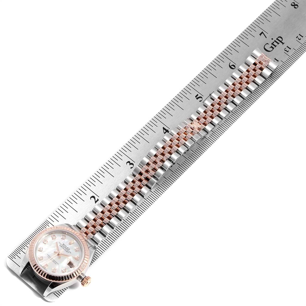 The image shows a Rolex Datejust 279171 Women's Steel and Gold (two tone) Mother of Pearl Dial 279171 Women's Steel and Gold (two tone) Mother of Pearl Dial watch laying flat with a ruler measuring its bracelet length.