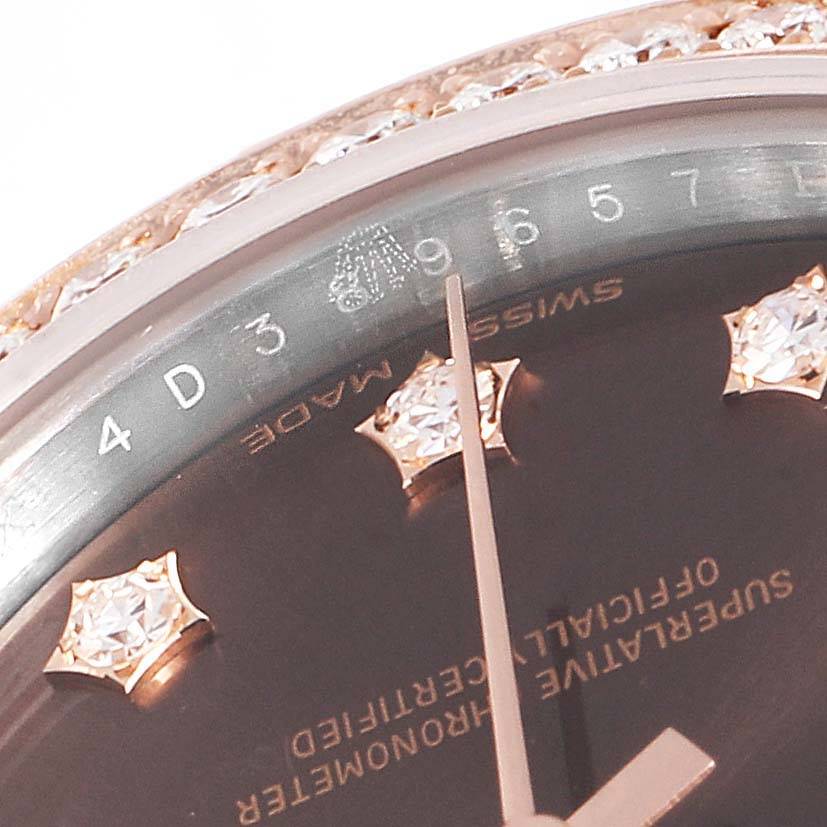 This close-up image shows the bezel and part of the dial of a Rolex Datejust 279381 Women's Steel and Gold (two tone) Brown Dial 279381 Women's Steel and Gold (two tone) Brown Dial watch, displaying its diamond hour markers.