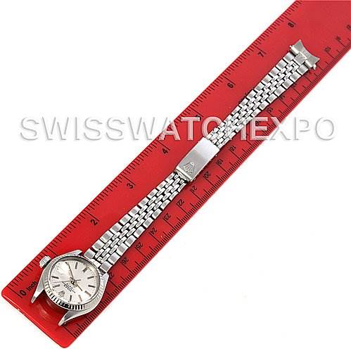 The image shows a top-down view of the Rolex Datejust 6917 Women's Stainless Steel Silver Dial 6917 Women's Stainless Steel Silver Dial watch, alongside a red ruler for scale.