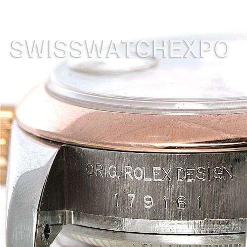 The image shows a close-up of the side of the Rolex Datejust 179161 Women's Steel and Gold (two tone) White Dial 179161 Women's Steel and Gold (two tone) White Dial watch case, detailing the engraved model number and "ORIG. ROLEX DESIGN" text.