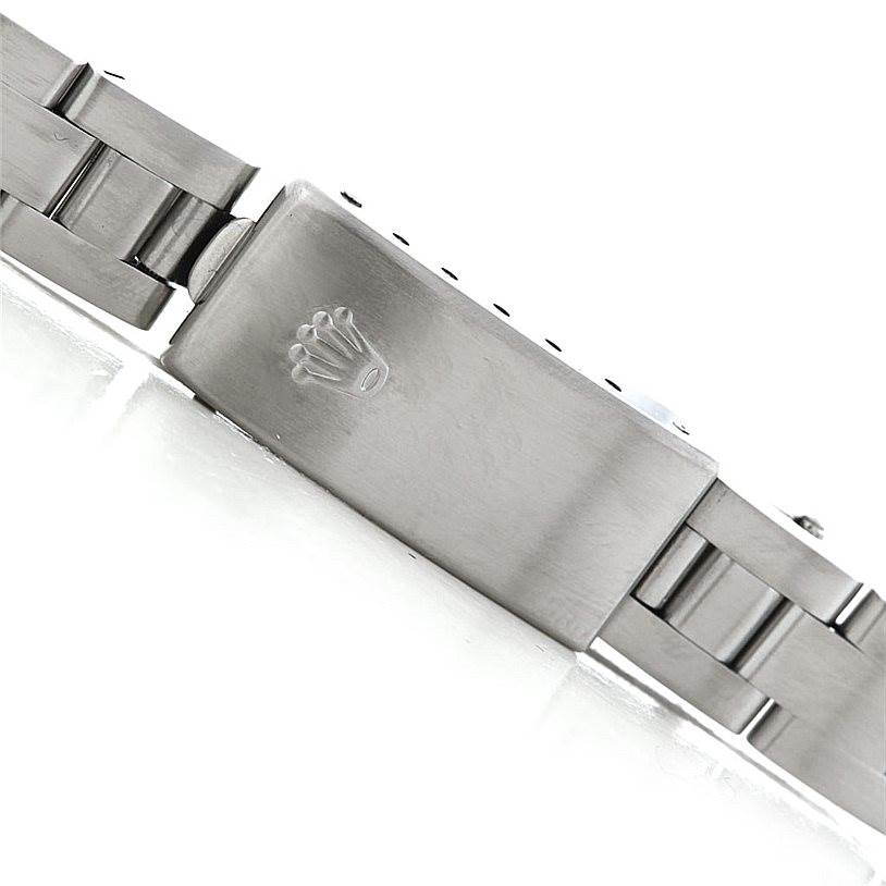 The image shows the clasp and part of the bracelet of a Rolex Datejust 79160 Women's Stainless Steel White Dial 79160 Women's Stainless Steel White Dial watch, focused on the Rolex logo on the clasp.