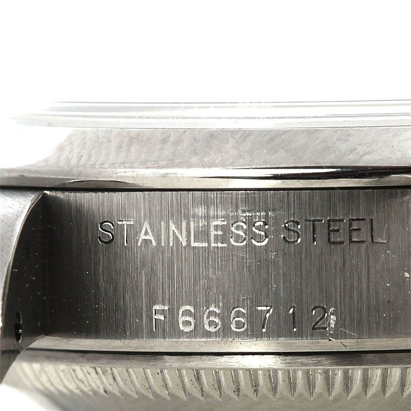 The image shows a close-up of the stainless steel case side and serial number of a Rolex Datejust 79160 Women's Stainless Steel White Dial 79160 Women's Stainless Steel White Dial watch.